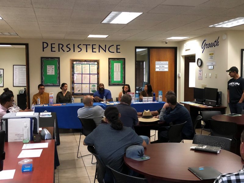 Photo: Local community resource partners gather at a GEO Reentry center to share services with participants