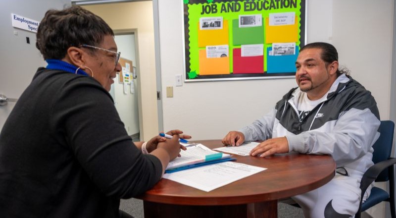 Participant meeting with program staff during a pretrial and diversion program.