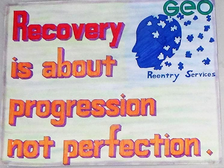 Program participants created recovery-themed signs.