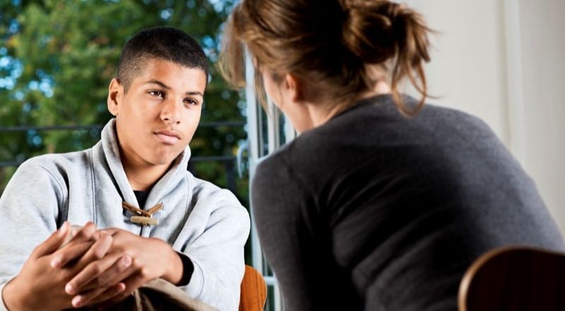 Youth meeting with a case manager in a GEO Reentry Services juvenile justice program